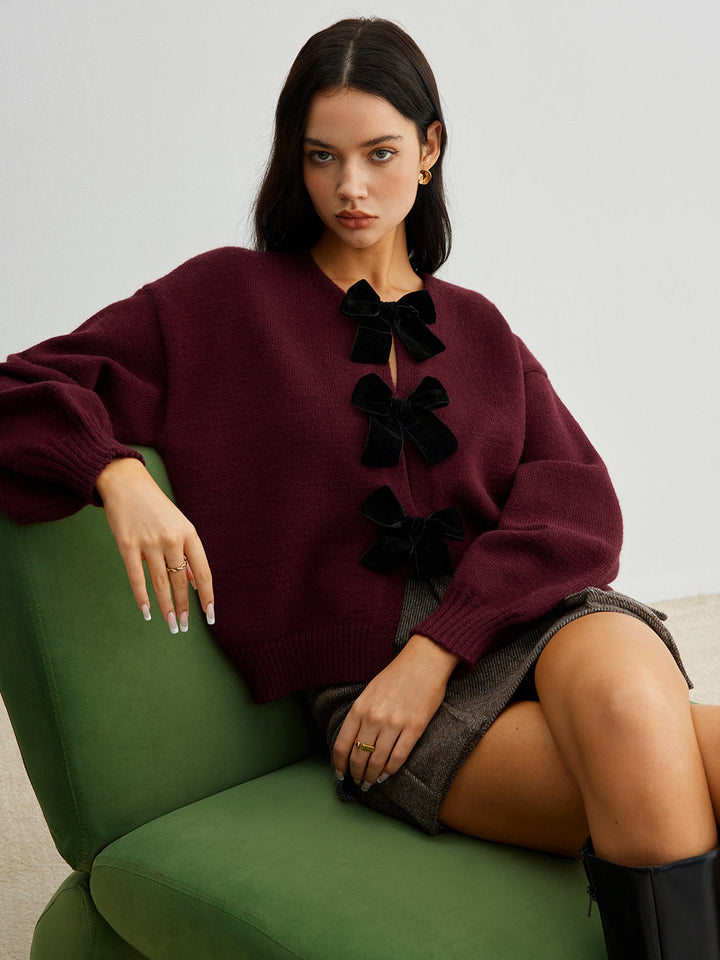 Drune | Strickcardigan mit Samtschleifen Wollmischung Feminin und Modern