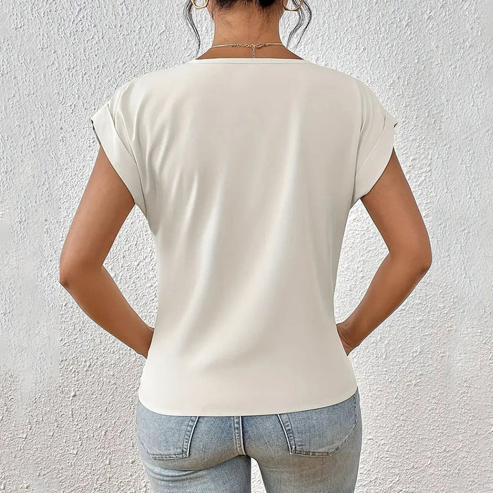 Drune | Elegantes, einfarbiges T-Shirt mit V-Ausschnitt und gedrehtem Saum für Damen