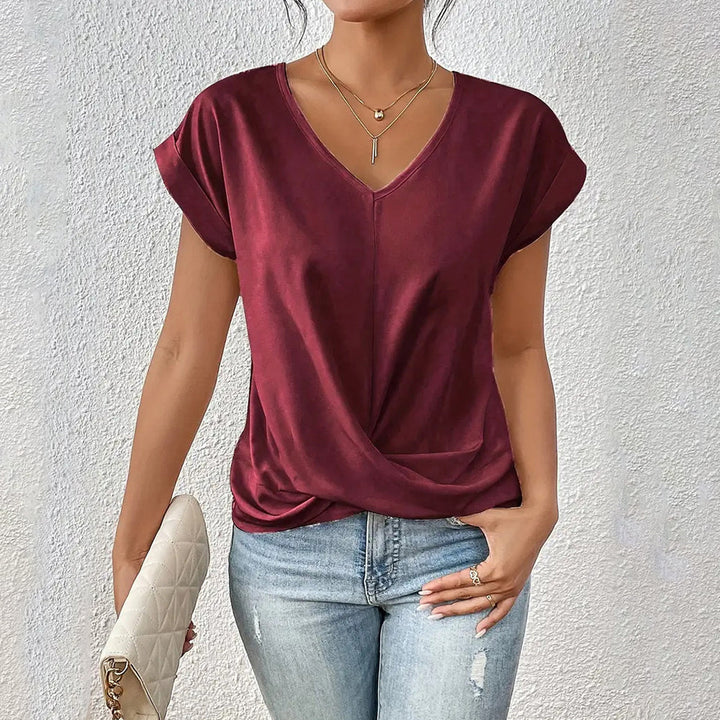 Drune | Elegantes, einfarbiges T-Shirt mit V-Ausschnitt und gedrehtem Saum für Damen