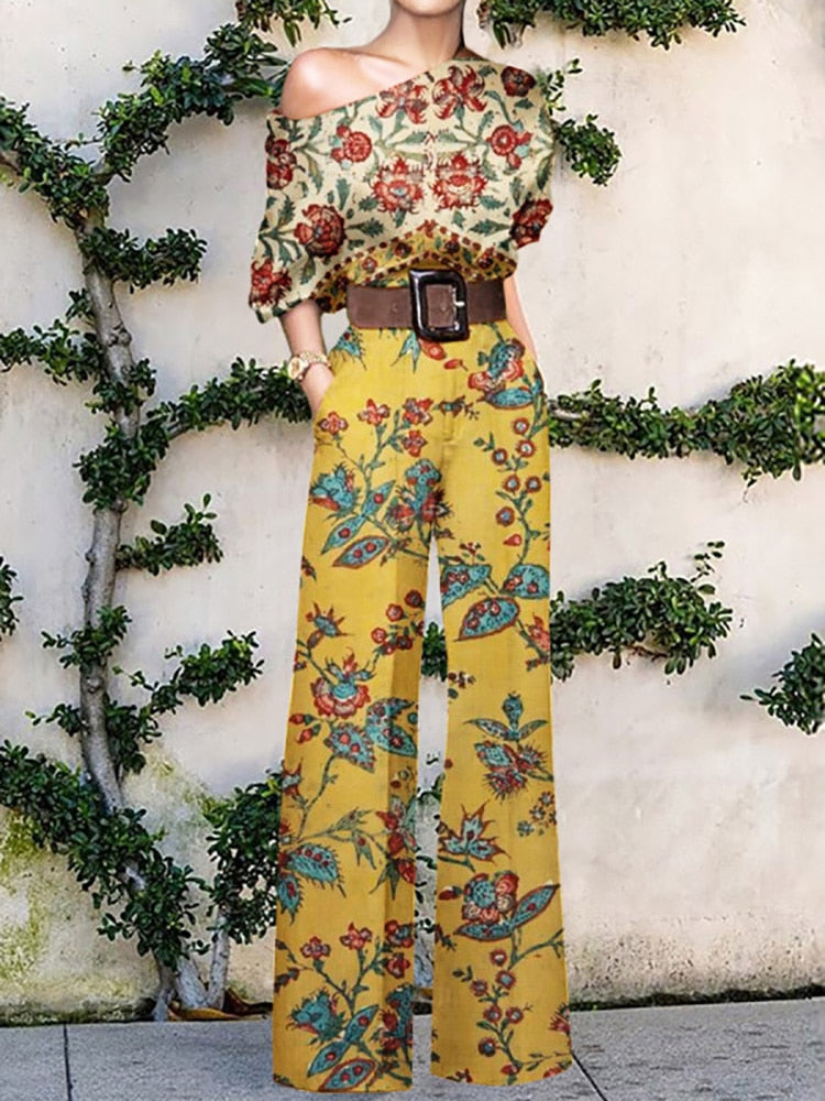Drune | trägerloser Jumpsuit mit Blumenmuster