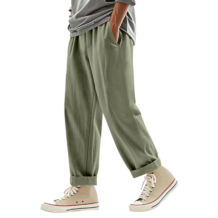 Herren nan weite Bundfalten-Chinohose mit Umschlag, konisch zulaufendem Schnitt und seitlichen Eingrifftaschen Drune