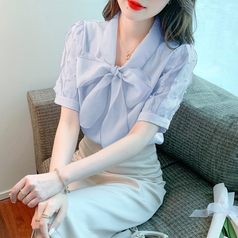 Damen Bluse mit elegantem Schleifen-Ausschnitt und strukturierten Ärmeln Drune