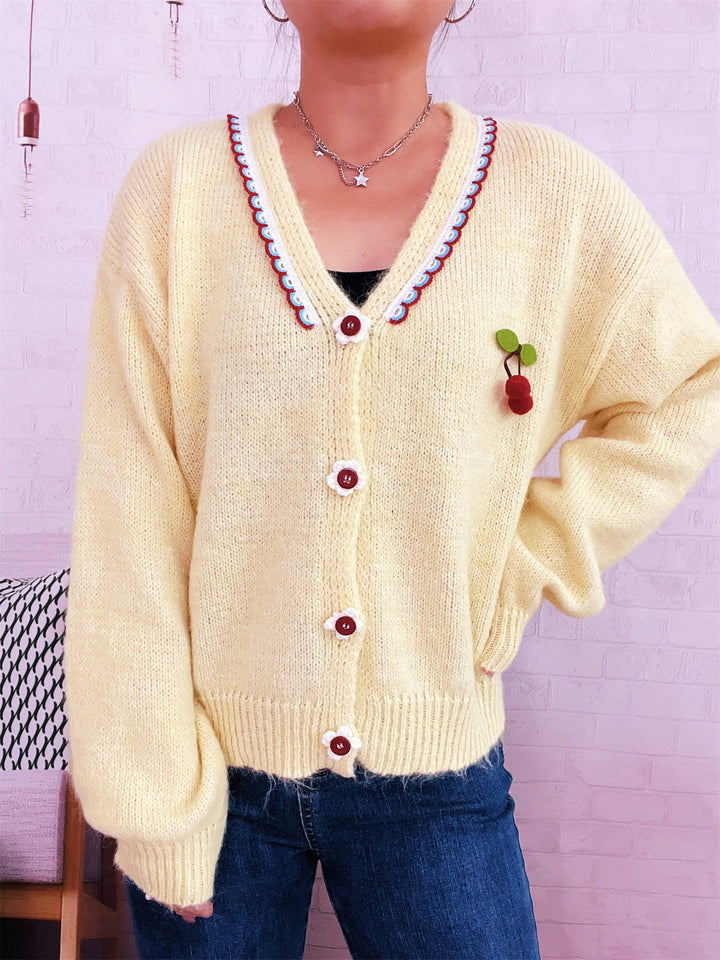 Damen kuschelige Strickjacke mit verspieltem Blütenmuster und Knopfdetails Drune
