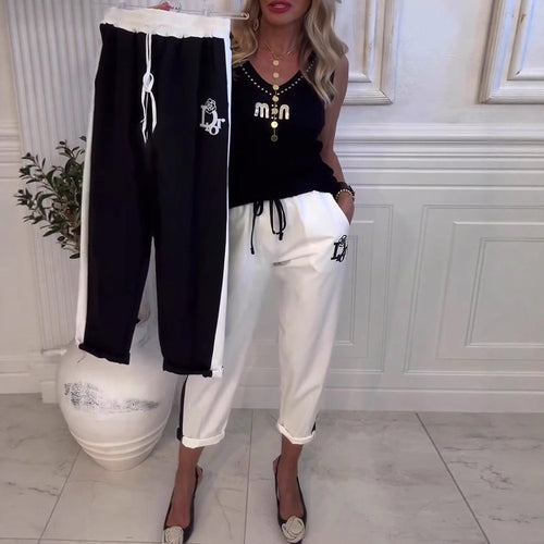Damen nan Cropped-Jogginghose mit kontrastierendem Bund, seitlichem Zierstreifen, Kordelzug und Logostickerei Drune