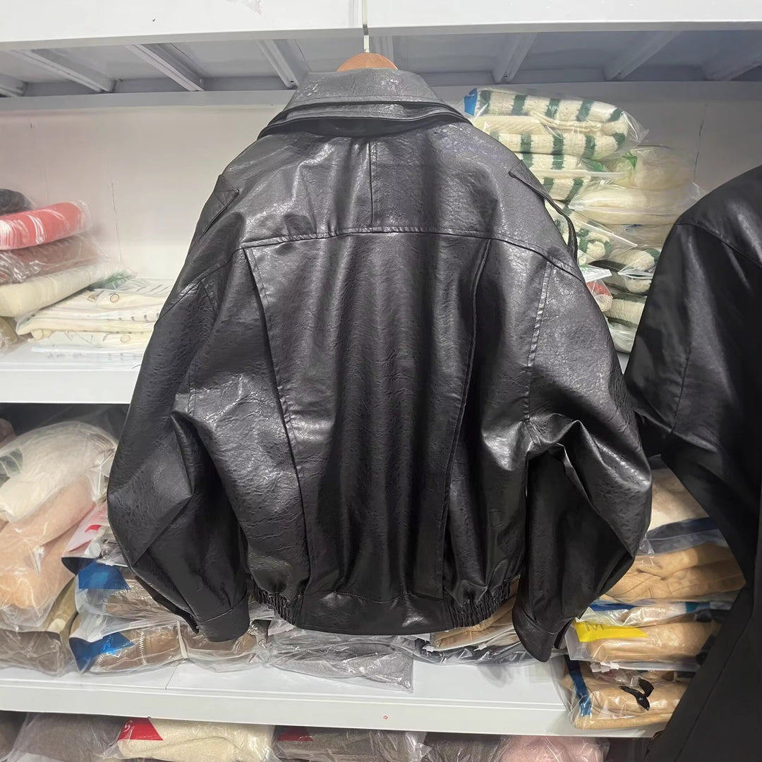 Damen modische Kunstlederjacke mit asymmetrischem Schnitt und dekorativem Gürtel Drune