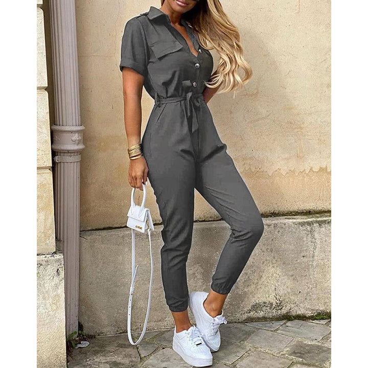 Damen figurbetonter Kurzoverall mit Knopfleiste und taillierbarem Gürtel Drune