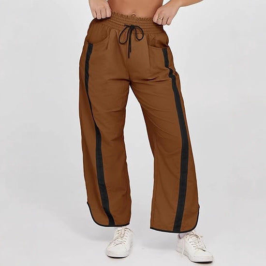 Damen nan relaxte Trackpants mit seitlichem Kontraststreifen, elastischem Smokbund und Eingrifftaschen Drune