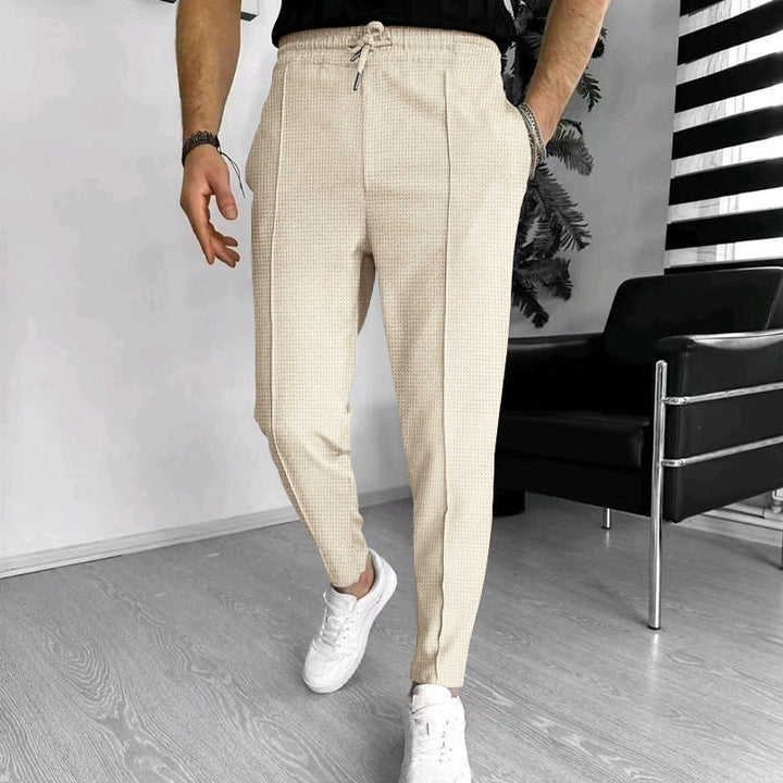 Herren nan schmal zulaufende Jogging-Chino aus strukturierter Webqualität mit elastischem Tunnelzugbund und dekorativer Bügelfalte Drune