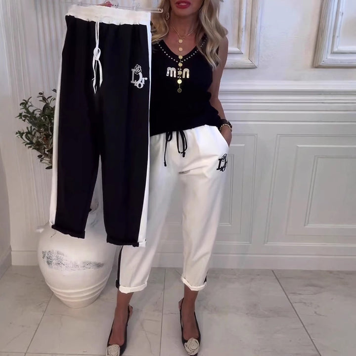 Damen nan Cropped-Jogginghose mit kontrastierendem Bund, seitlichem Zierstreifen, Kordelzug und Logostickerei Drune