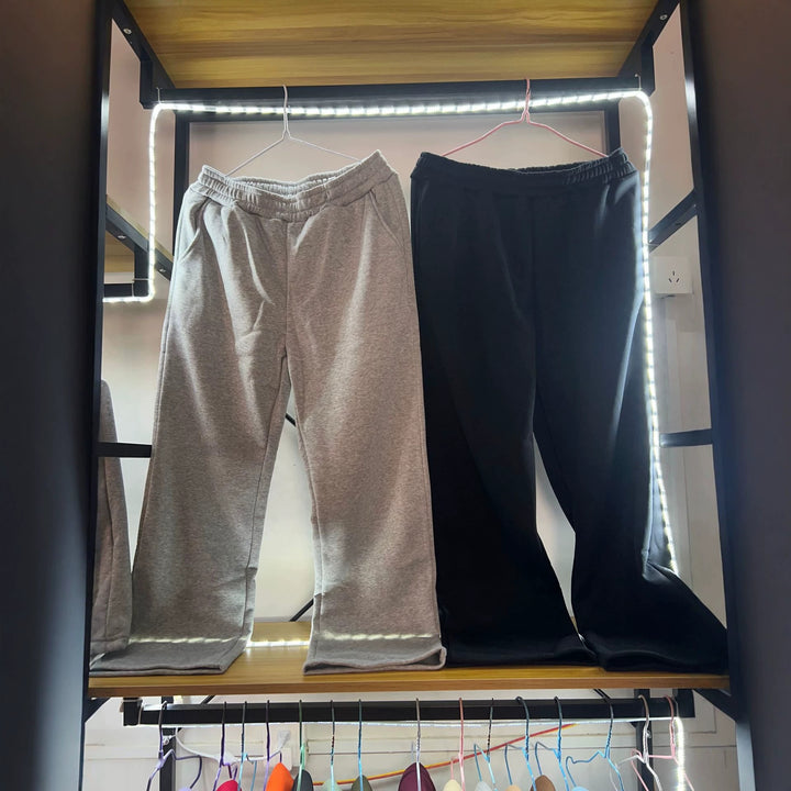 Damen nan weite Loungehose mit elastischem Bund, seitlichen Eingrifftaschen und fließendem Bein Drune