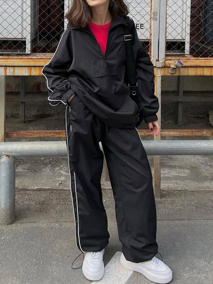 Damen sportliche Windbreaker-Jacke mit hohem Kragen und modischen Details Drune