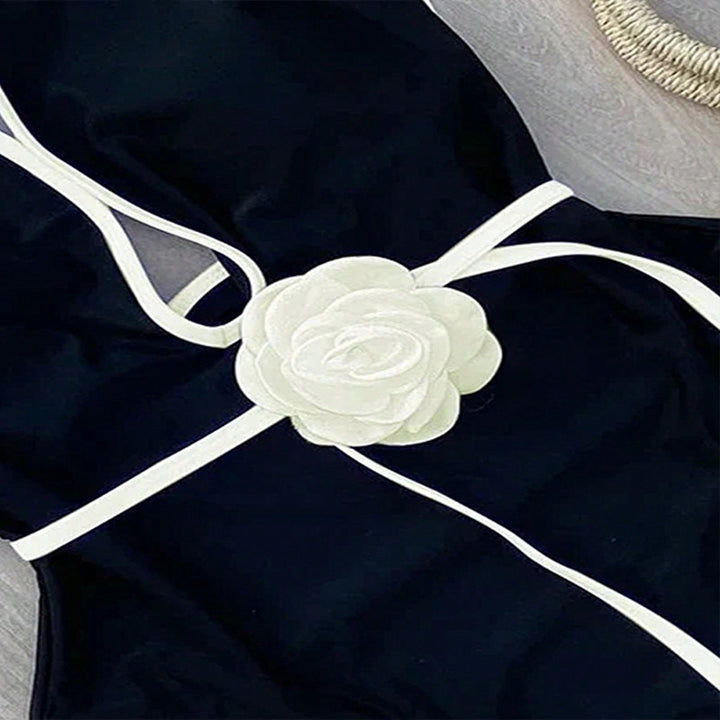 Damen Eleganter einteiliger Badeanzug mit floralem Akzent Drune