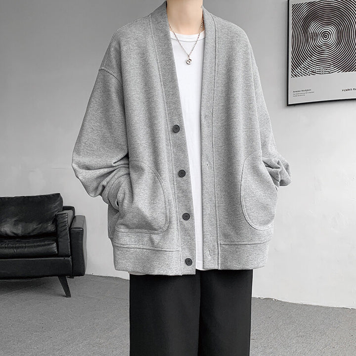 Herren nan oversized Strickcardigan mit V-Ausschnitt, aufgesetzten Rundtaschen und lässiger Drop-Shoulder-Silhouette Drune