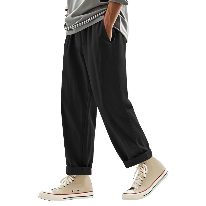 Herren nan weite Bundfalten-Chinohose mit Umschlag, konisch zulaufendem Schnitt und seitlichen Eingrifftaschen Drune