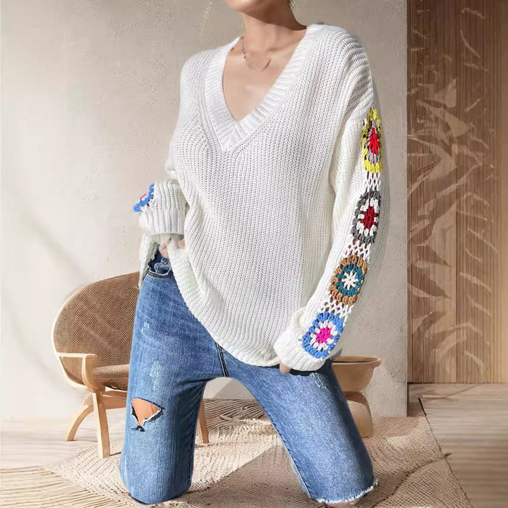 Damen modischer Strickpullover mit einzigartiger Schnittführung und kreativen Häkelmotiven Drune