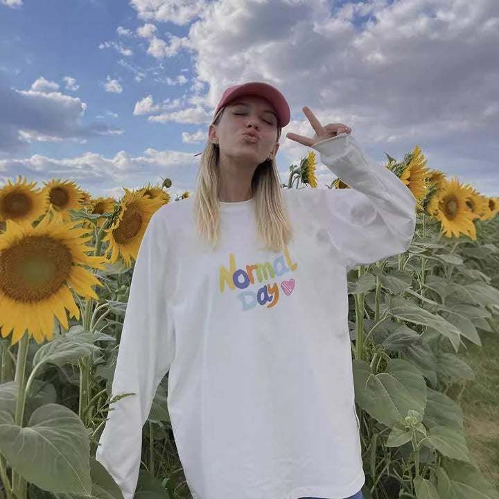 Damen lässiges Langarmshirt mit buntem Schriftzug Drune