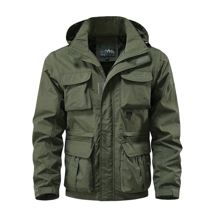 Herren nan multifunktionale Fieldjacke mit Kapuze, zahlreichen Klapp- und Reißverschlusstaschen sowie wind- und wasserabweisender Membran Drune