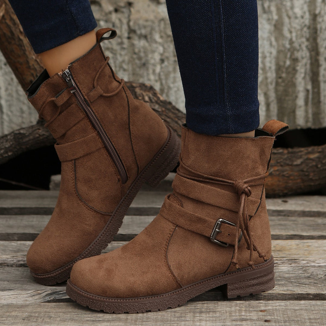 Damen nan Kurzstiefelette aus Veloursoptik mit seitlichem Reißverschluss, dekorativem Wickelriemen und robust profilierter Sohle Drune