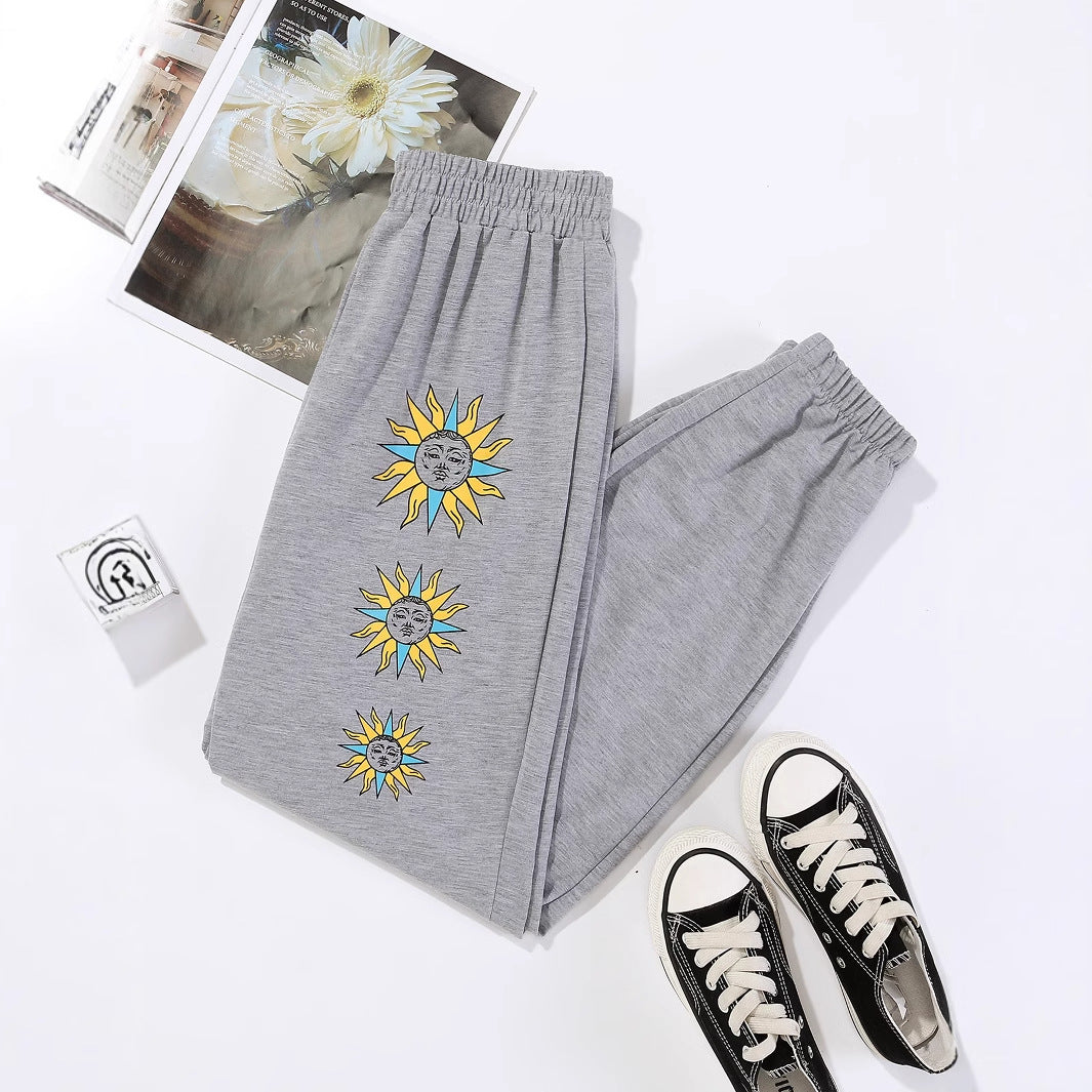 Damen bequeme Sweatpants mit trendigem Sonnenmotiv Drune
