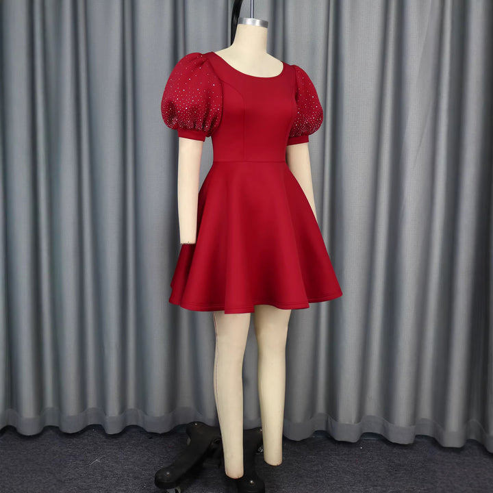 Damen Cocktailkleid mit voluminösen Puffärmeln und schimmernden Akzenten Drune