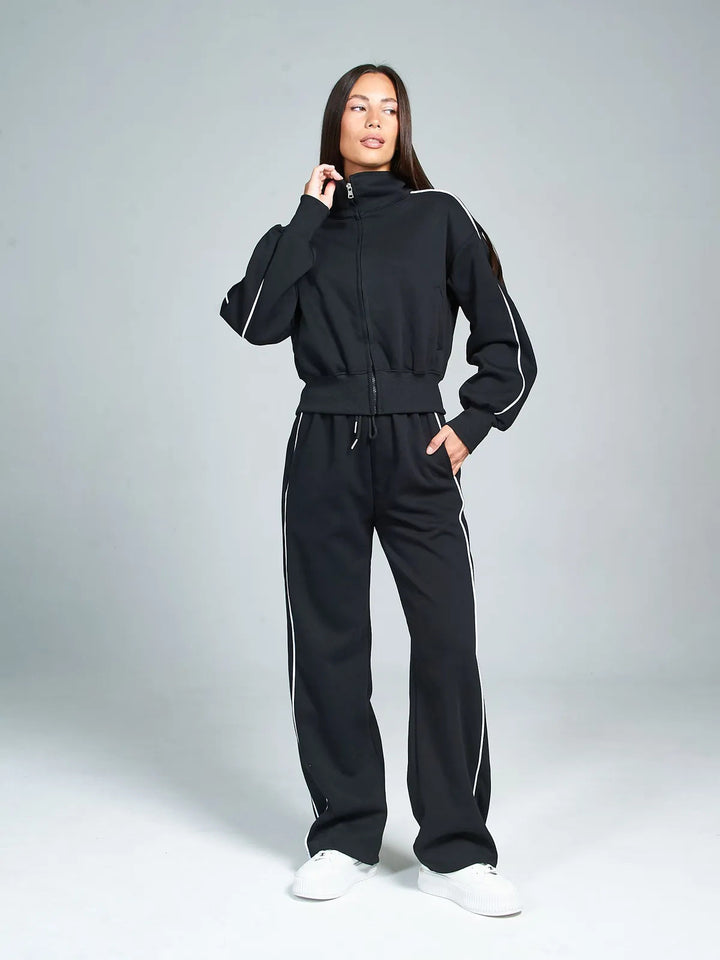 Damen sportliches Freizeit-Set mit hochgeschlossener Jacke und weit geschnittenen Hosen Drune