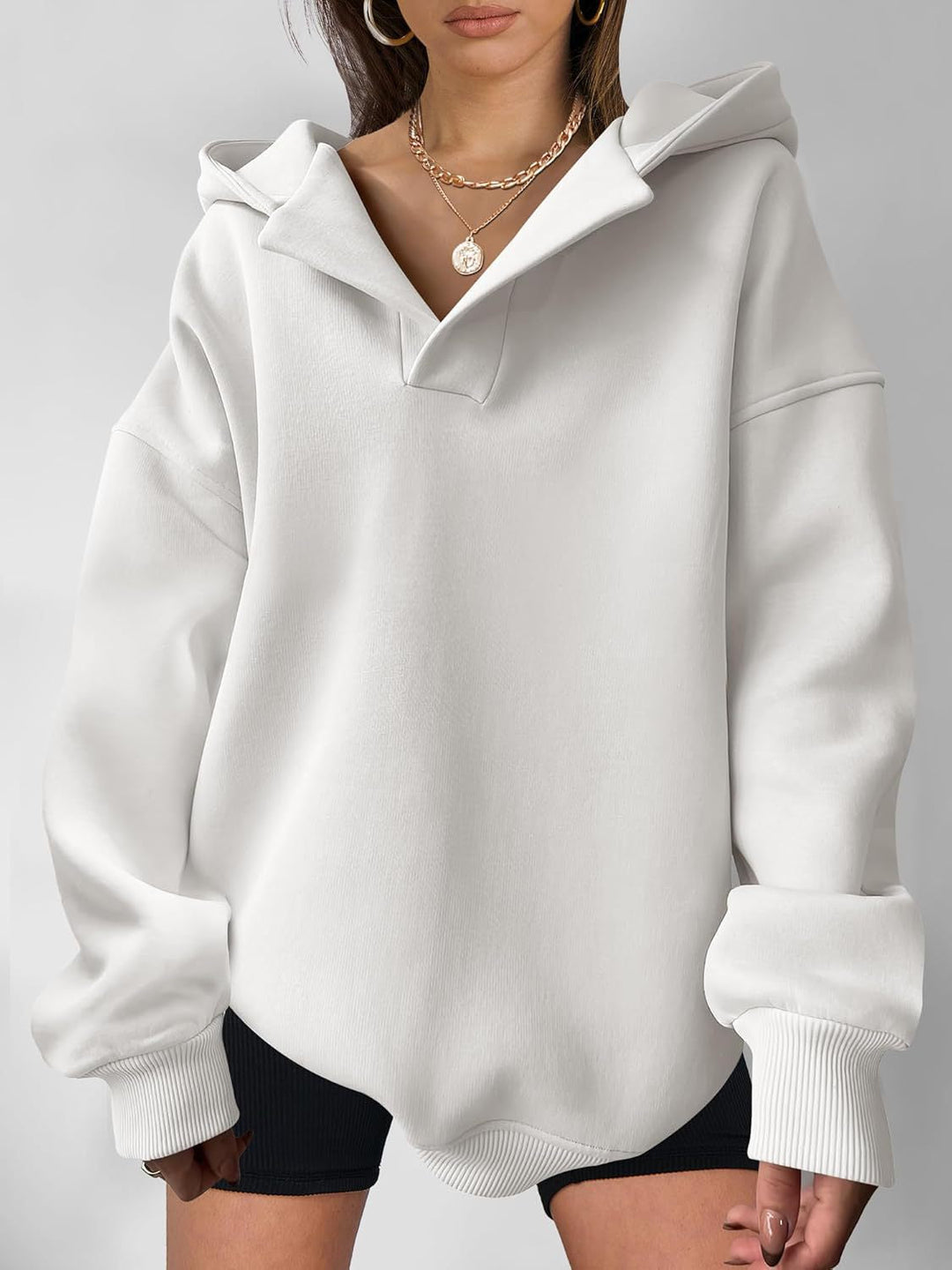 Damen Oversized Hoodie mit kurzem Kragen und praktischen Seitentaschen Drune