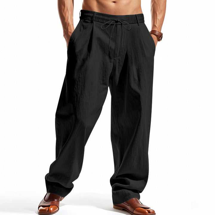 Herren nan weite Bundfalten-Chinohose mit Umschlag, konisch zulaufendem Schnitt und seitlichen Eingrifftaschen Drune