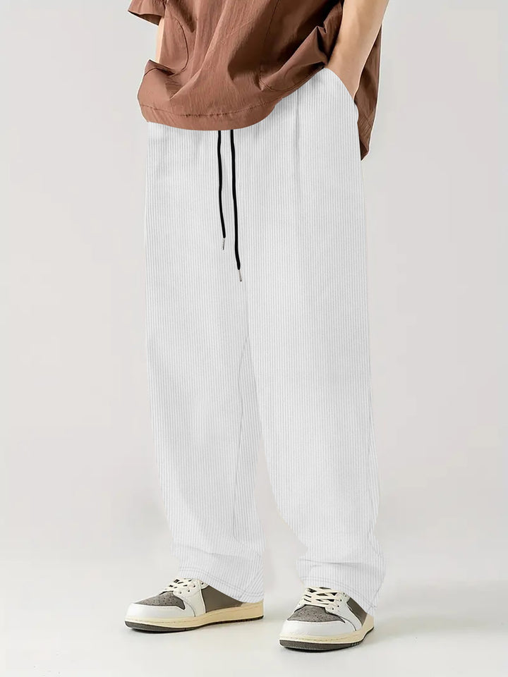 Herren nan weite Relax-Freizeithose aus geripptem Jersey mit Kordelzug, Seitentaschen und weitem Bein Drune