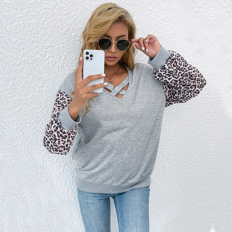 Damen modischer Pullover mit trendigen Animal-Print-Ärmeln und raffiniertem V-Ausschnitt Drune