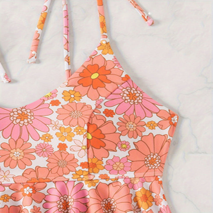 Damen attraktives Flatter-Badeoberteil mit floralem Design und passend hochgeschnittenem Slip Drune