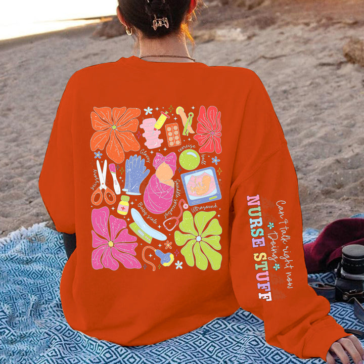 Damen Sweatshirt mit buntem Grafikdesign und originellem Pflege-Motiv Drune