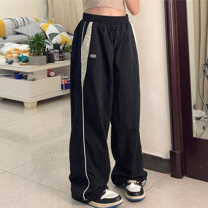 Damen nan weite Trackhose mit Kontrastpaspel, elastischem Bund und Oversize-Schnitt Drune