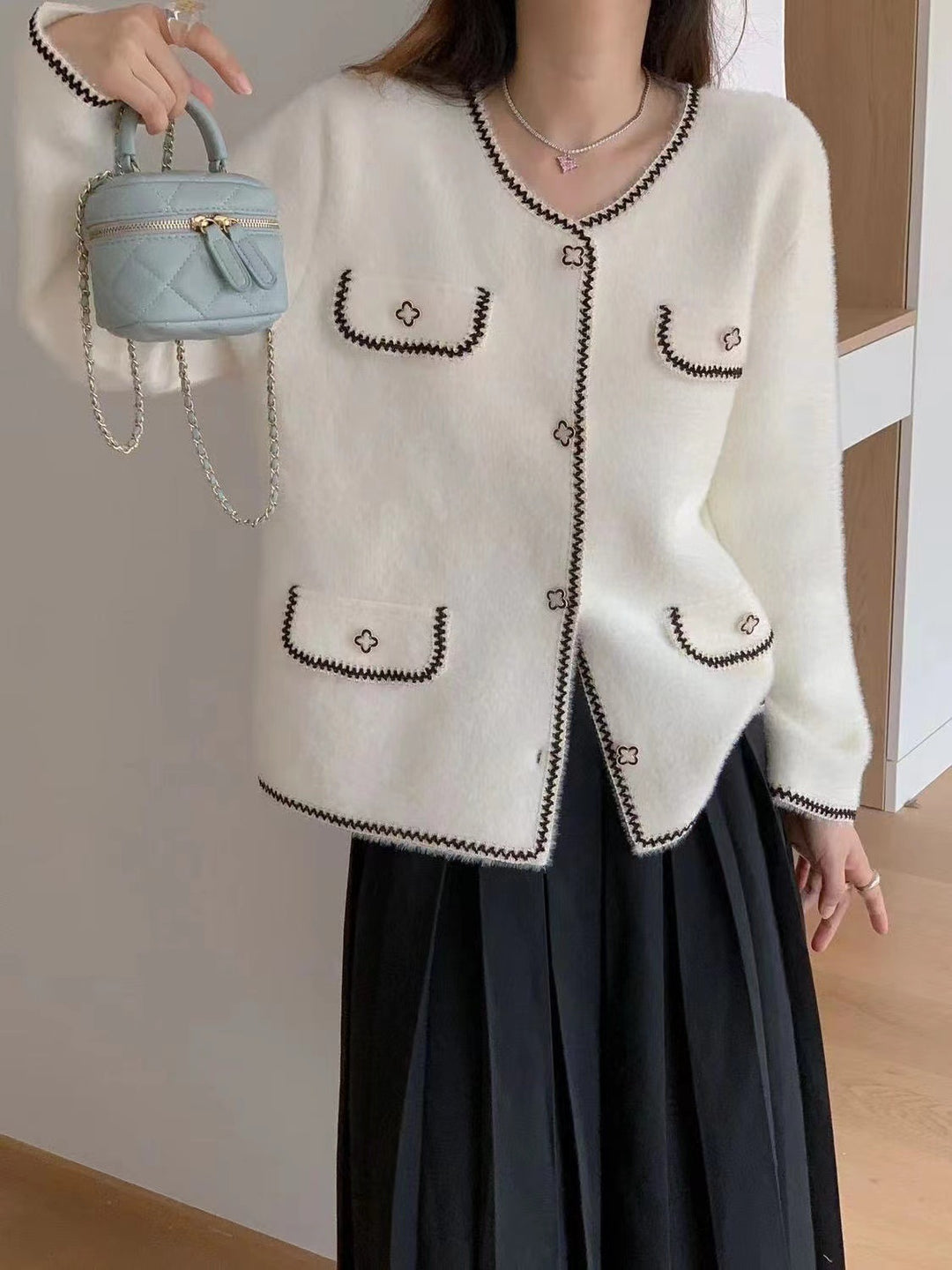 Damen elegante Strickjacke mit Kontrastnähten und Taschen Drune