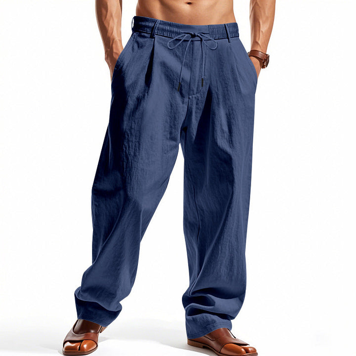 Herren nan weite Bundfalten-Chinohose mit Umschlag, konisch zulaufendem Schnitt und seitlichen Eingrifftaschen Drune