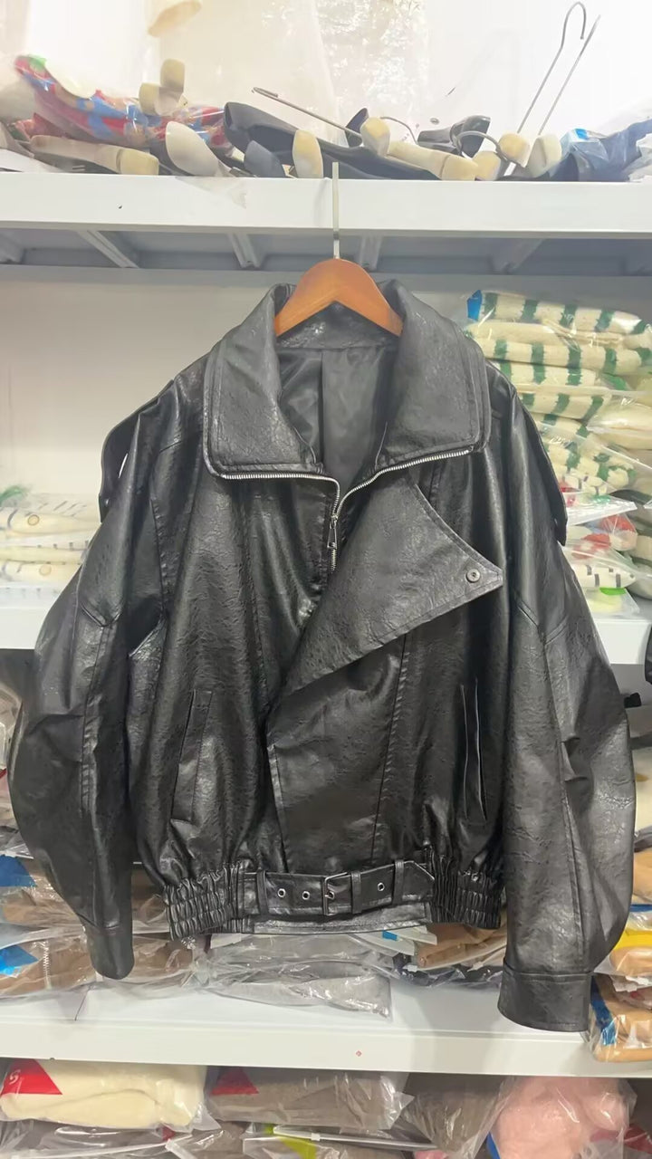 Damen modische Kunstlederjacke mit asymmetrischem Schnitt und dekorativem Gürtel Drune