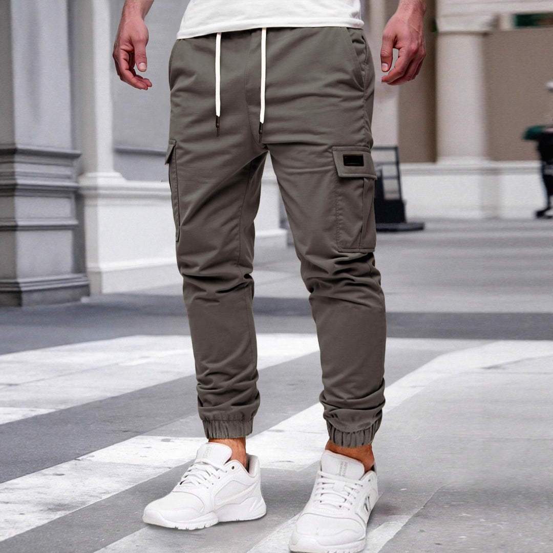 Herren nan tapered Freizeit-Cargohose mit aufgesetzten Klapptaschen, Tunnelzugbund und elastischen Beinabschlüssen Drune