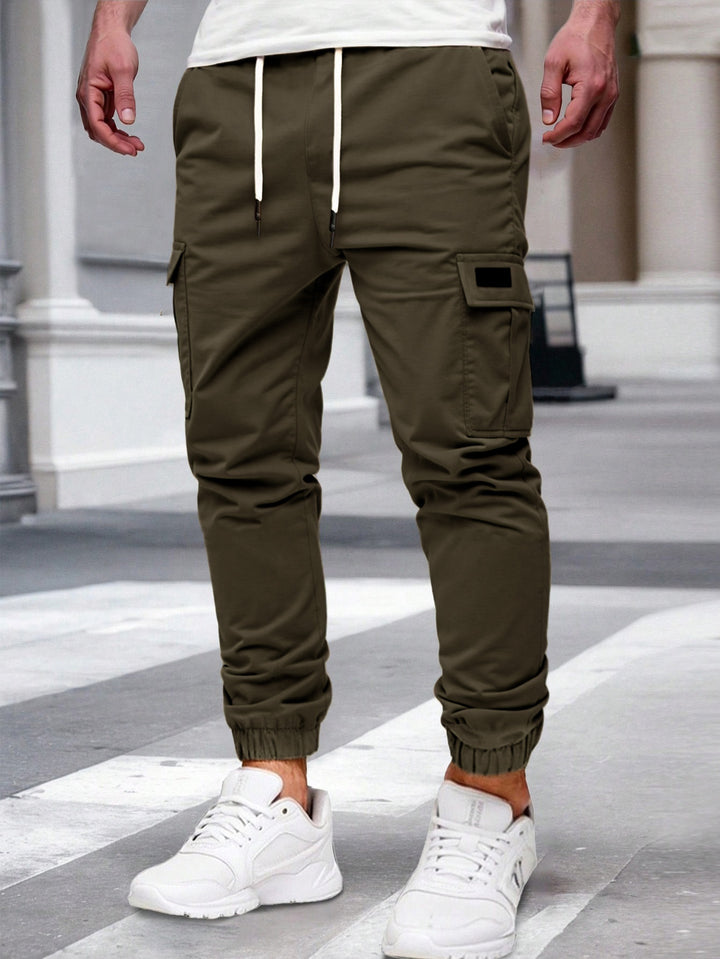 Herren nan tapered Freizeit-Cargohose mit aufgesetzten Klapptaschen, Tunnelzugbund und elastischen Beinabschlüssen Drune