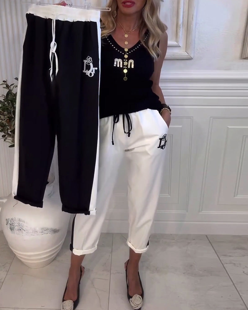 Damen nan Cropped-Jogginghose mit kontrastierendem Bund, seitlichem Zierstreifen, Kordelzug und Logostickerei Drune
