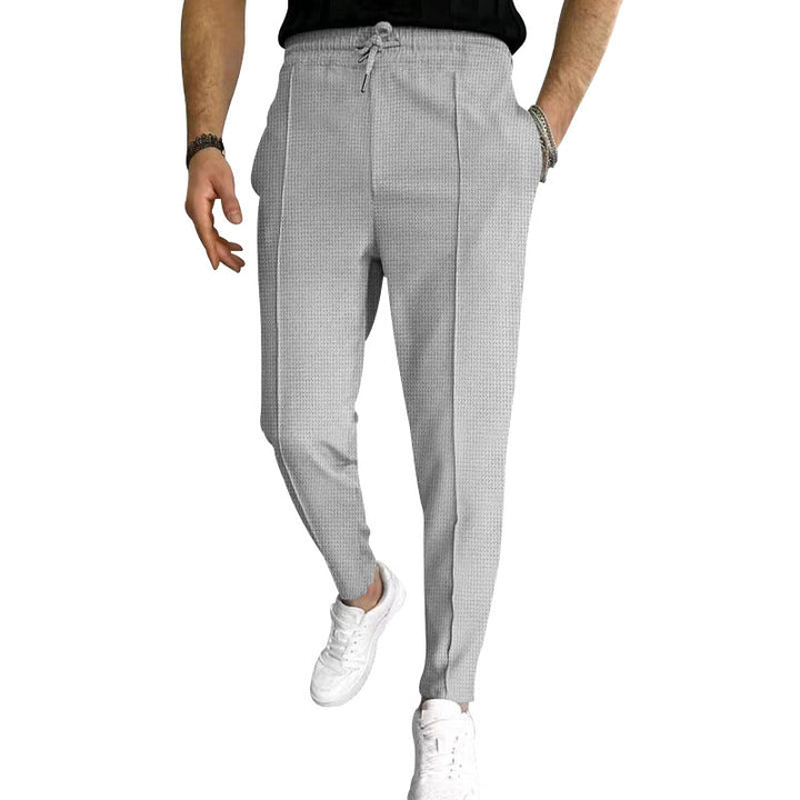 Herren nan schmal zulaufende Jogging-Chino aus strukturierter Webqualität mit elastischem Tunnelzugbund und dekorativer Bügelfalte Drune