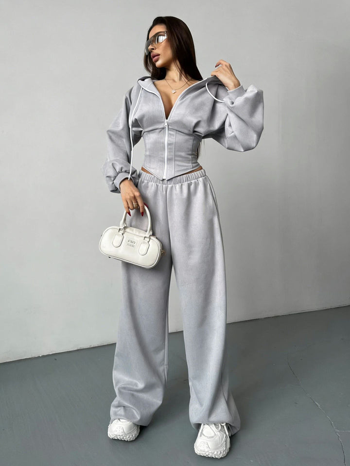 Damen sportliches Set aus cropped Kapuzenjacke und weiten Jogginghosen mit elastischem Bund Drune