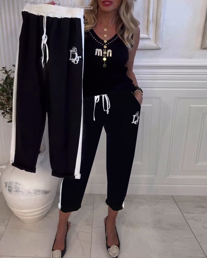 Damen nan Cropped-Jogginghose mit kontrastierendem Bund, seitlichem Zierstreifen, Kordelzug und Logostickerei Drune