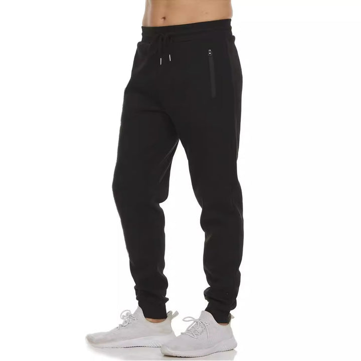 Damen nan tapered Jogginghose mit elastischem Komfortbund, wasserabweisender Reißverschlusstasche und geripptem Knöchelabschluss Drune