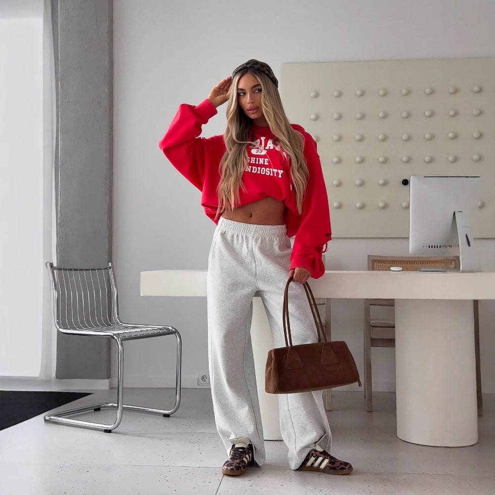 Damen cropped Kapuzenpullover mit kreativen Schnittdetails und großer Schriftzug Drune