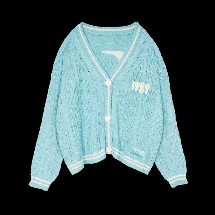 Damen nan kurz geschnittene Strickjacke mit V-Ausschnitt, Kontrastpaspel und oversized Ärmeln Drune