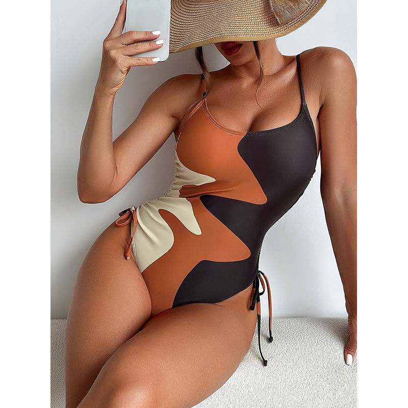 Damen Einteiler Badeanzug mit asymmetrischem Muster und verstellbarem Bindeband Drune